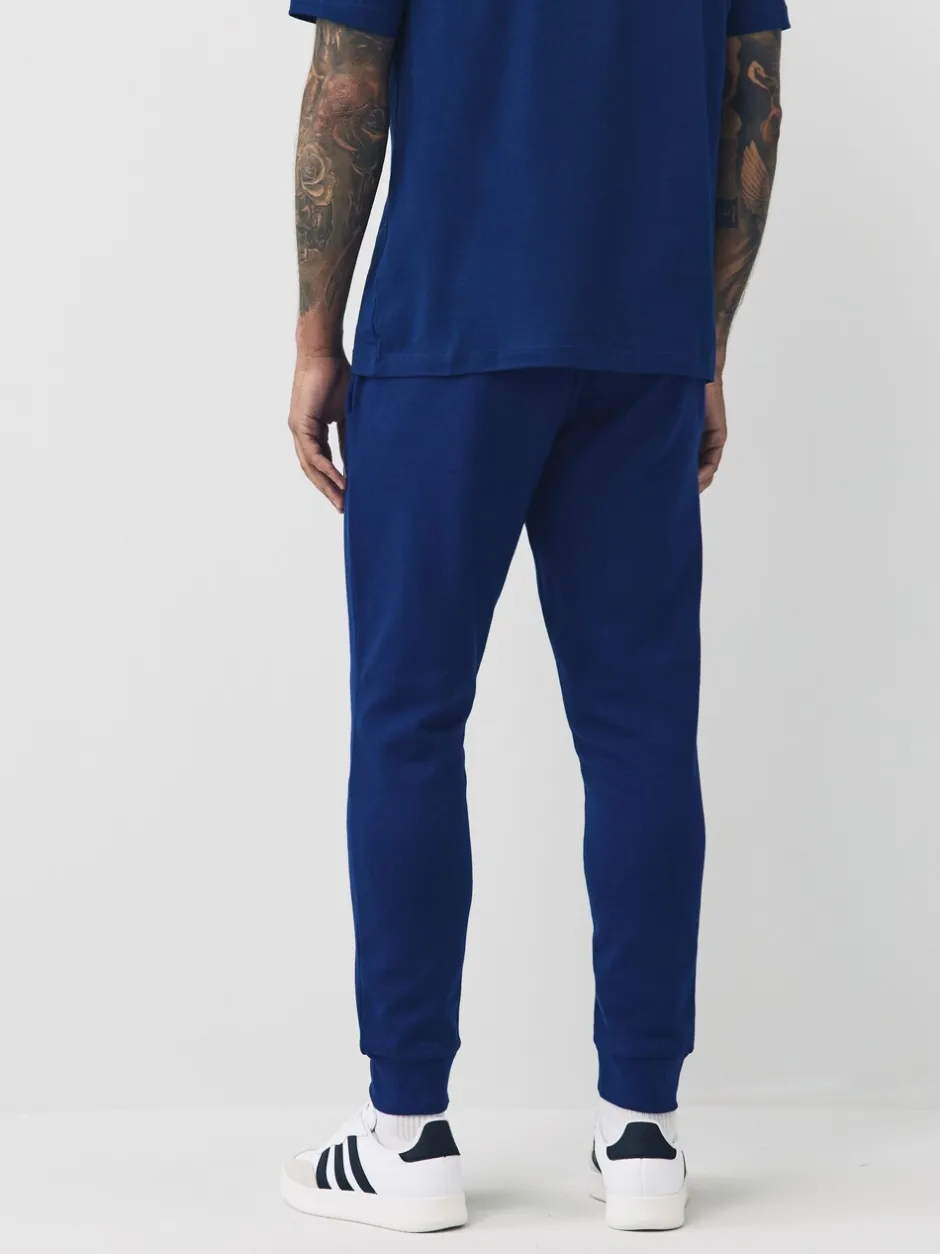 Joggingbroeken*adidas - Essentials Feelcozy fleece joggingbroek Blauw