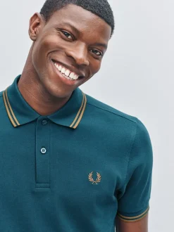 Poloshirts*Fred Perry Blauw - polo met tweekleurig gestreept randje