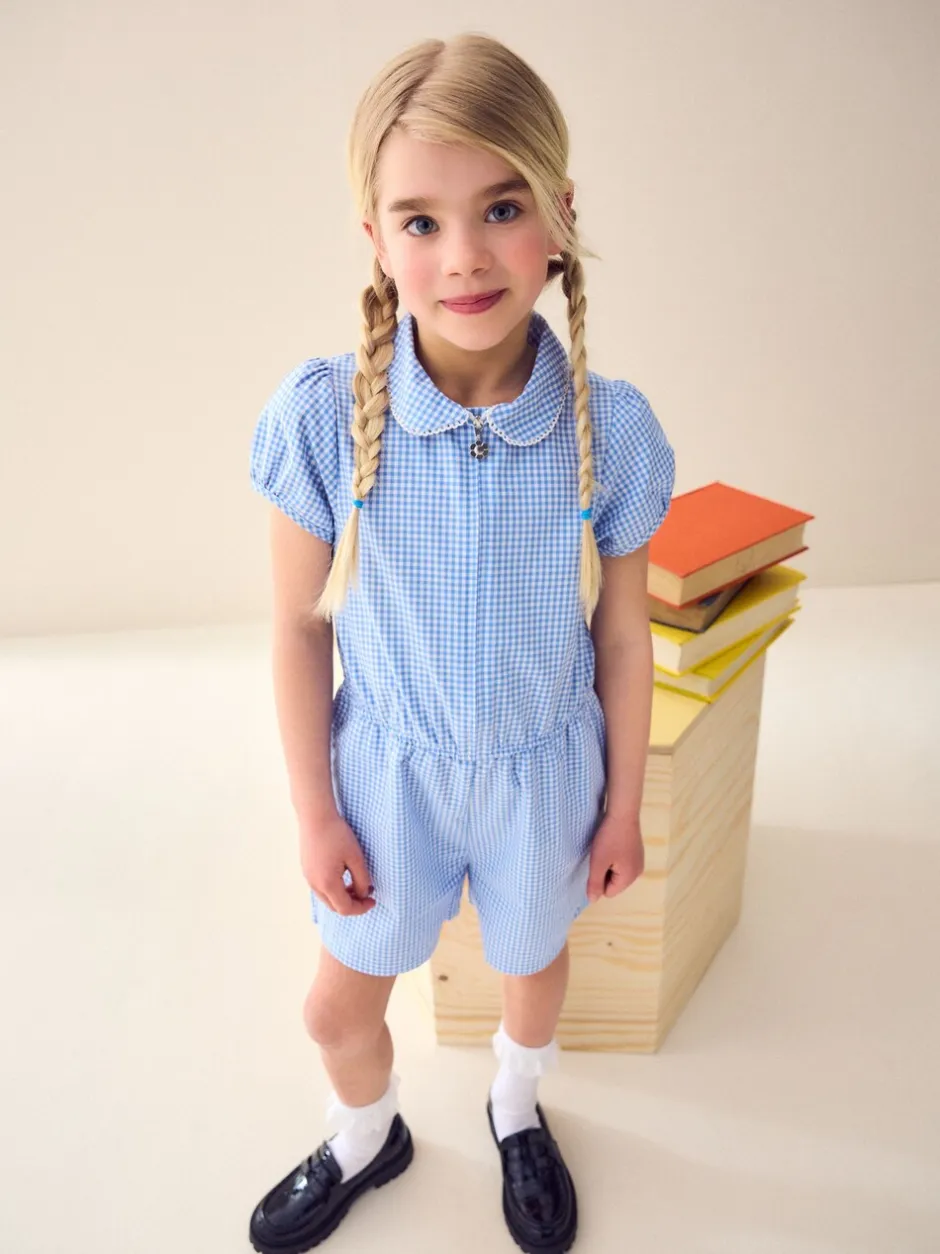 Jumpsuits En Playsuits*Next - Geruit schoolspeelpakje met rits aan de voorzijde en hoog aandeel katoen (3 - 14 jr) Blauw