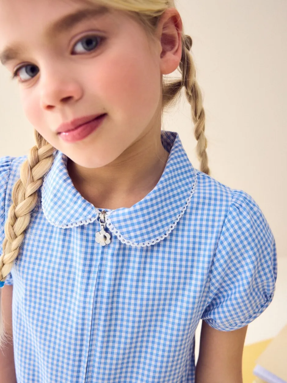 Jumpsuits En Playsuits*Next - Geruit schoolspeelpakje met rits aan de voorzijde en hoog aandeel katoen (3 - 14 jr) Blauw