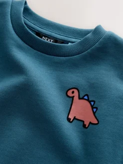 Truien En Breisels|Sweaters En Hoody´S*Next Blauw met dinosaurus - Jersey sweatshirt met ronde hals en print op de rug (3mnd -7jr)