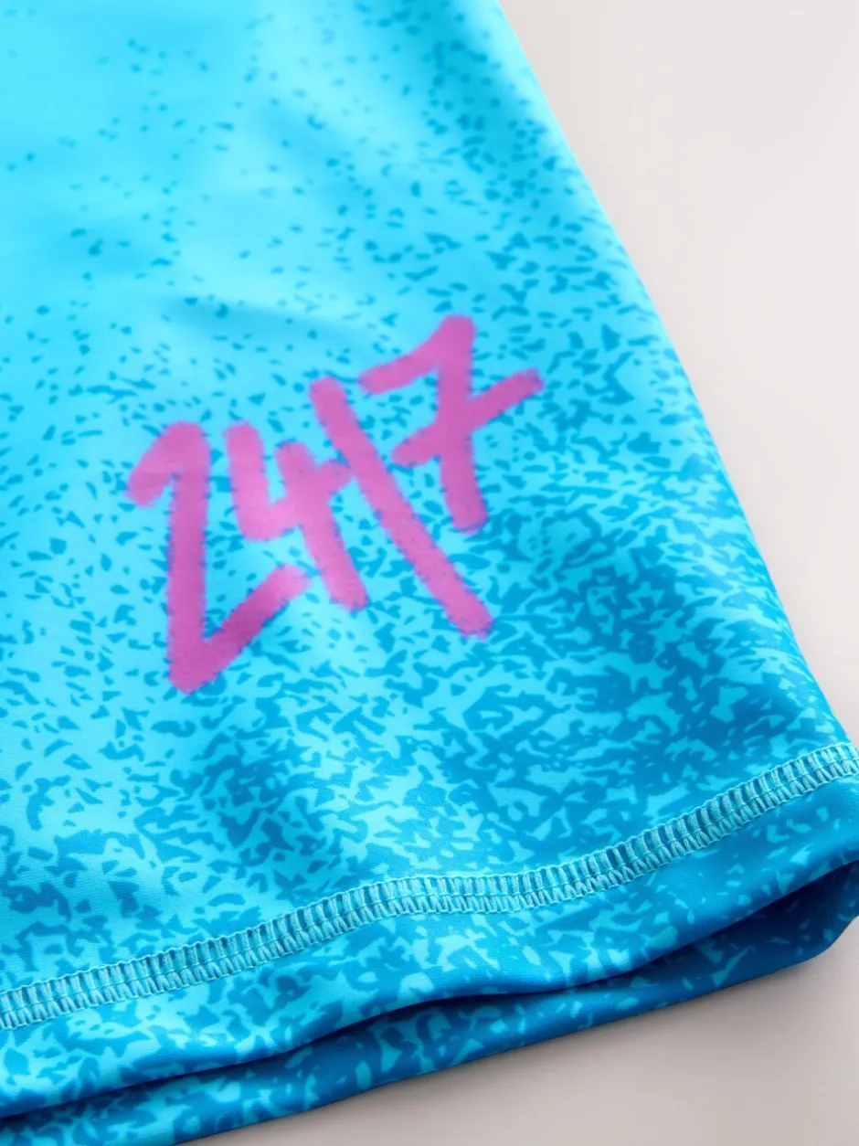 Badkleding*Next Blauw met graffitiprint - Surfhemdje (1,5 - 16 jr)