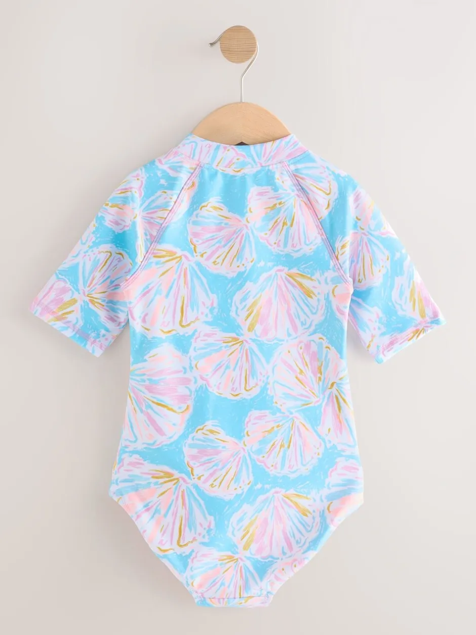 Badkleding*Next - Short Sleeved Sunsafe Swimsuit (3mths-16yrs) Blauw met schelp