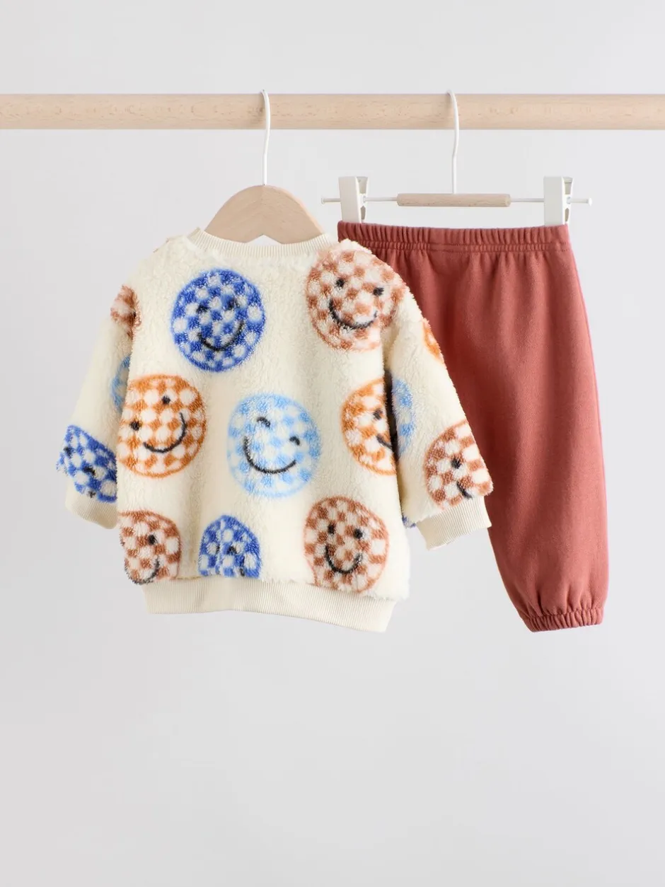 Truien En Breisels|Sets En Combisets|Next - Set van fleece top en joggingbroek voor baby's (0mnd -2jr) Blauwe gezichten met dambordmotief