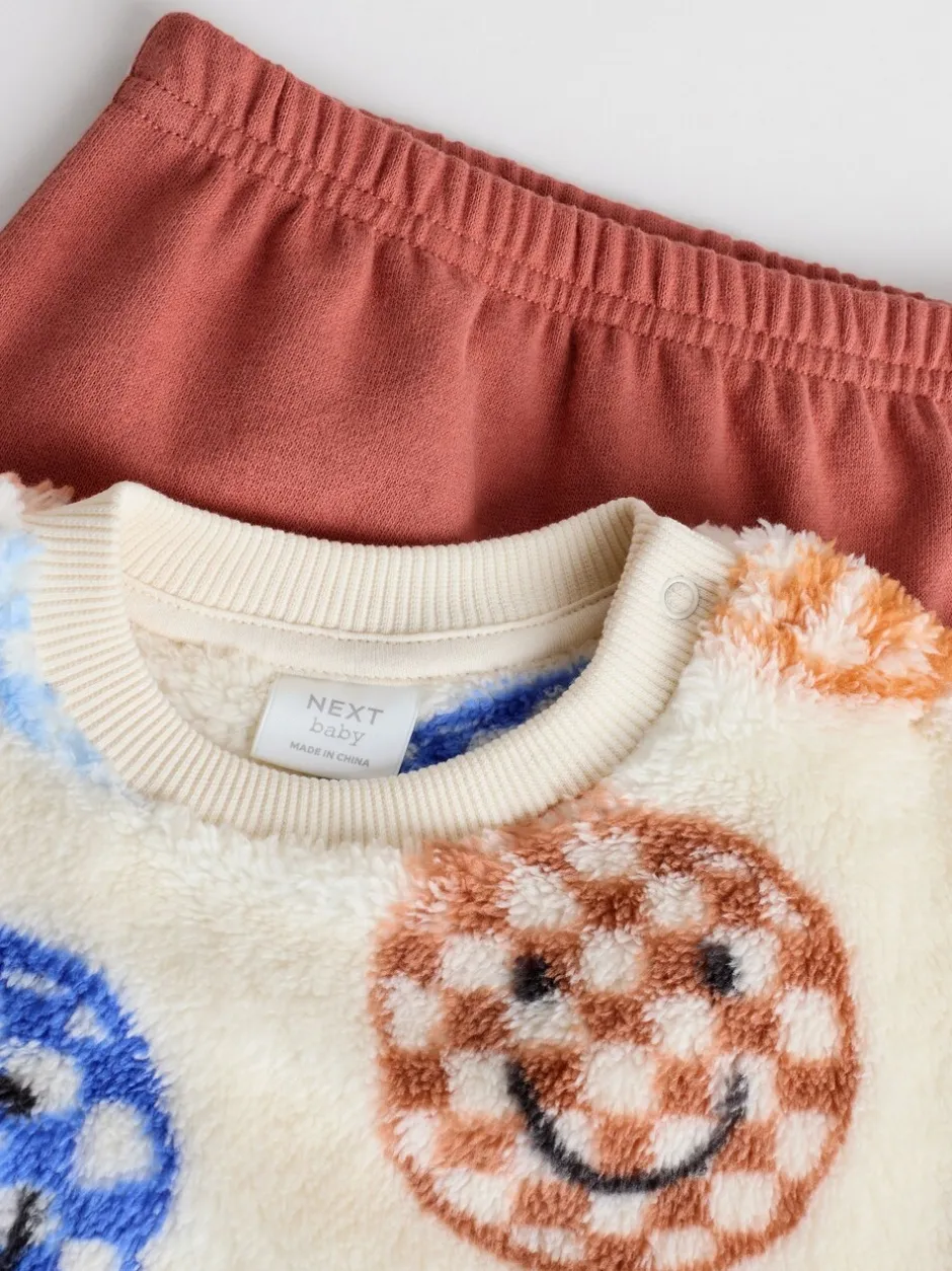 Truien En Breisels|Sets En Combisets|Next - Set van fleece top en joggingbroek voor baby's (0mnd -2jr) Blauwe gezichten met dambordmotief