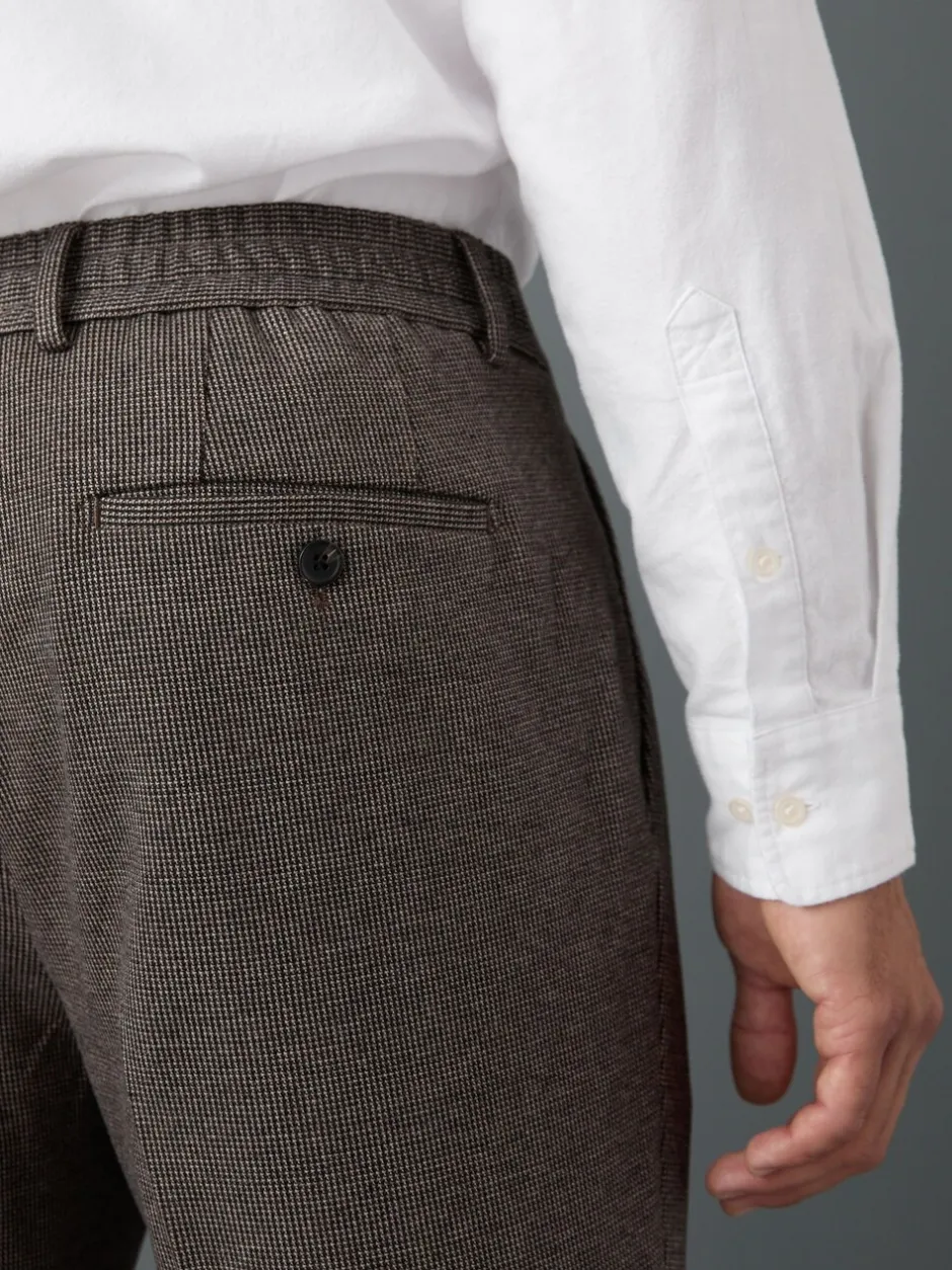 Formele Broek|Broeken En Chino's*Next - Slim fit getextureerde broek met elastische achterkant en stretchy Bruin