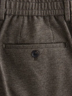 Formele Broek|Broeken En Chino's*Next - Slim fit getextureerde broek met elastische achterkant en stretchy Bruin