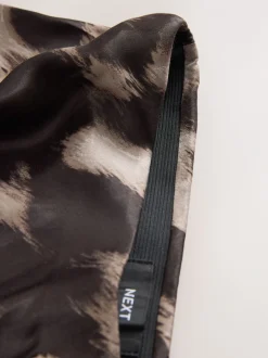 Rokken*Next - Satijnen midirok Bruin met dierenprint