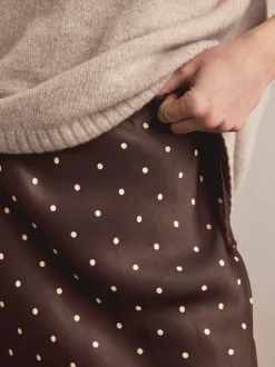 Rokken|Next - Satijnen midirok Chocoladebruin/Crème met stippen