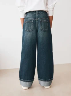 Jeans*Next Donkerblauw - Jeans met omgeslagen wijde pijpen (3-16jr)