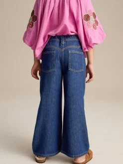 Jeans*Next Donkere inktblauwe wassing - Jeans met wijde pijpen (3-16 jr)