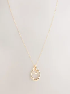 Sieraden|Next - Ketting met hangertje van vereende ringen Goudkleurig