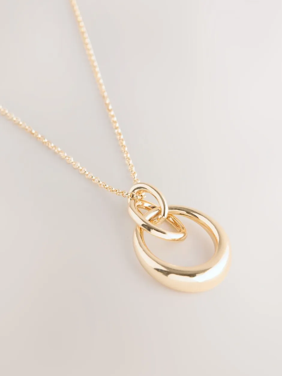 Sieraden|Next - Ketting met hangertje van vereende ringen Goudkleurig