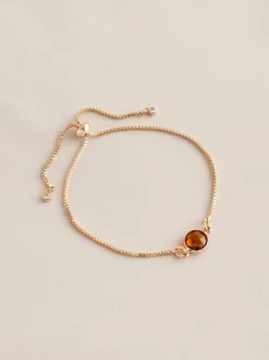 Sieraden|Next Goudkleurig - Trekarmband met geboortesteen