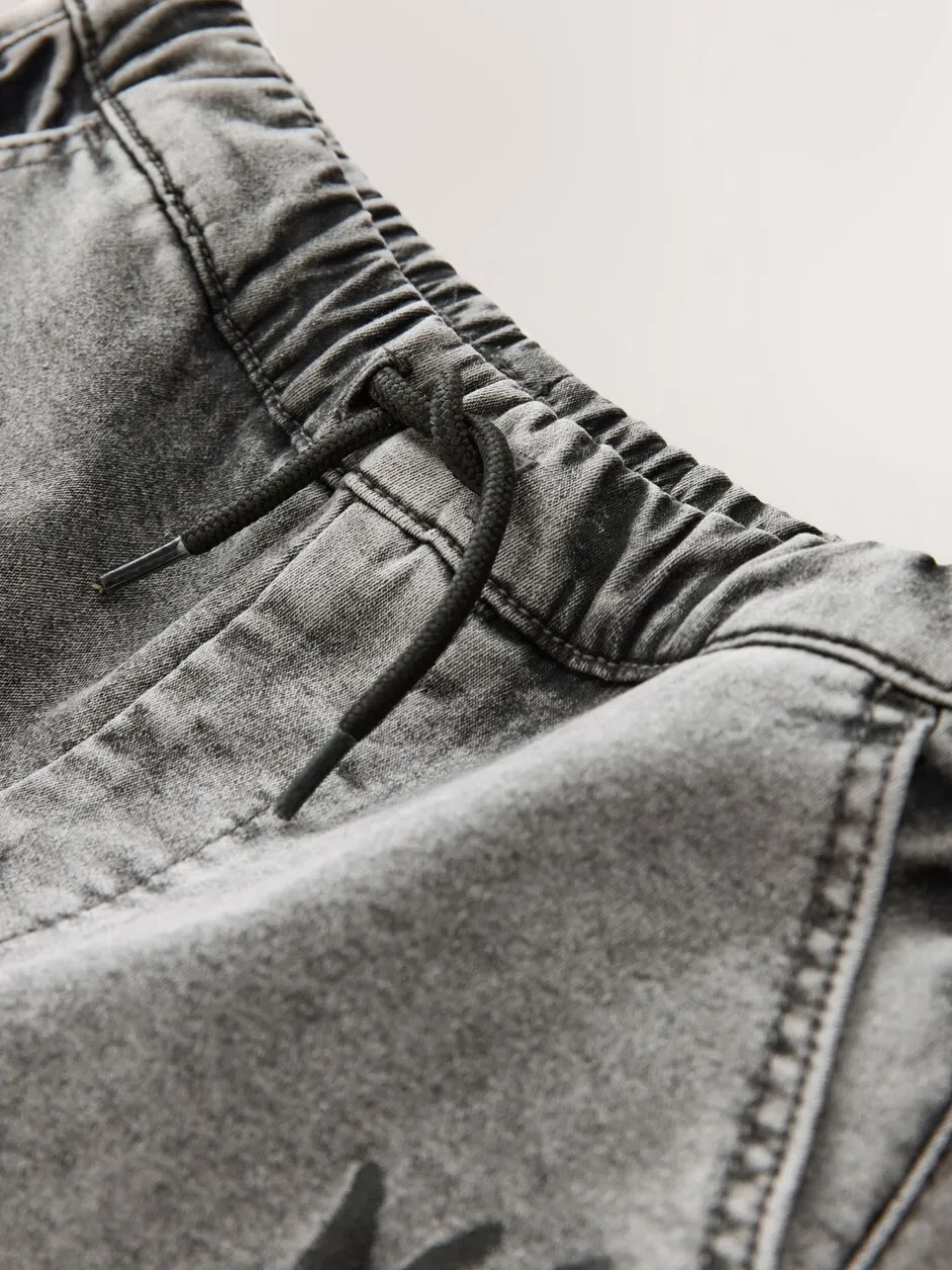 Jeans*Next - Cargo jeans met elastische taille (3-16 jr) Grijs met graffiti