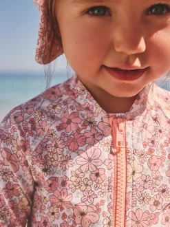 Badkleding*Next Koraalroze met fijne bloemenprint - Zonbeschermend badpak met lange pijpen (3 mnd-7 jr)