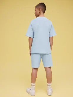 Shorts*Next - Set van T-shirt met textuur en korte mouwen en shorts (3 - 16 jr) Lichtblauw