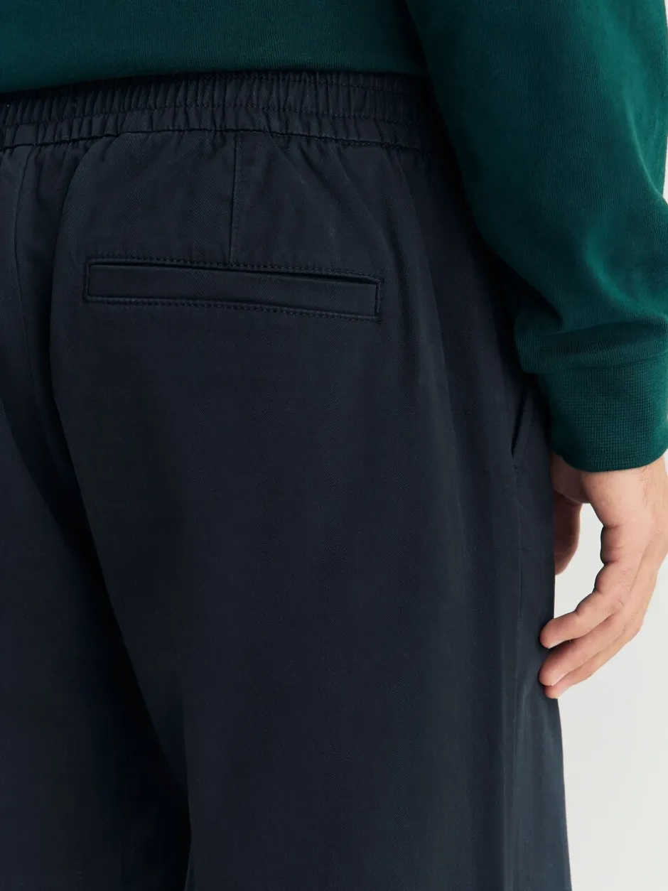 Broeken En Chino's*Next - Standaard toelopende pasvorm - Pleated Stretch Chinos Trousers With Elasticated Waist Marineblauw