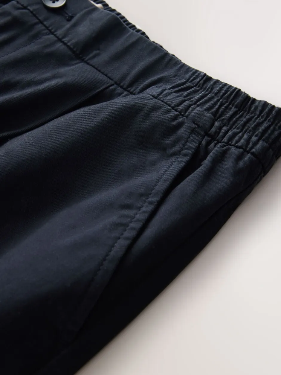 Broeken En Chino's*Next - Standaard toelopende pasvorm - Pleated Stretch Chinos Trousers With Elasticated Waist Marineblauw