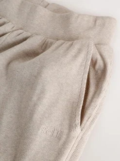 Pyjama's|Loungewear|self. - Geribbelde pyjama met knopen Moutkleurig
