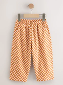 Broeken En Leggings*Next Oranje met dambordmotief - Broek met wijde kortere pijpen (3mnd -7jr)