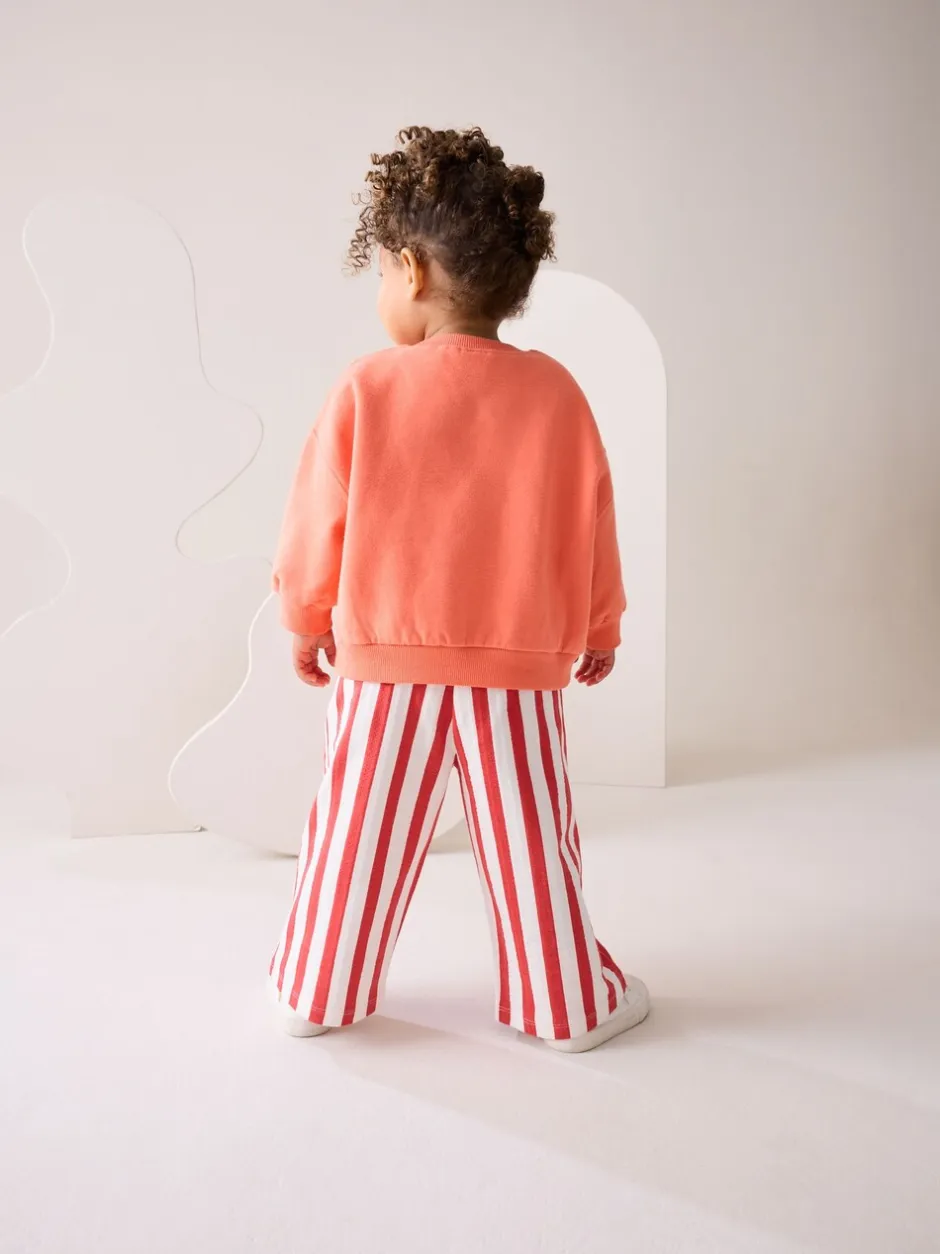 Sets En Combisets|Truien En Breisels*Next Oranje 'Squeeze the Day' - Set van sweatshirt en broek met wijde pijpen (3mnd -7jr)