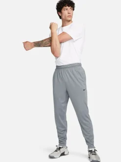 Joggingbroeken|Nike - Dri-FIT Totality trainingsbroek met taps toelopende pijpen Rookgrijs