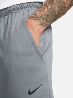 Joggingbroeken|Nike - Dri-FIT Totality trainingsbroek met taps toelopende pijpen Rookgrijs