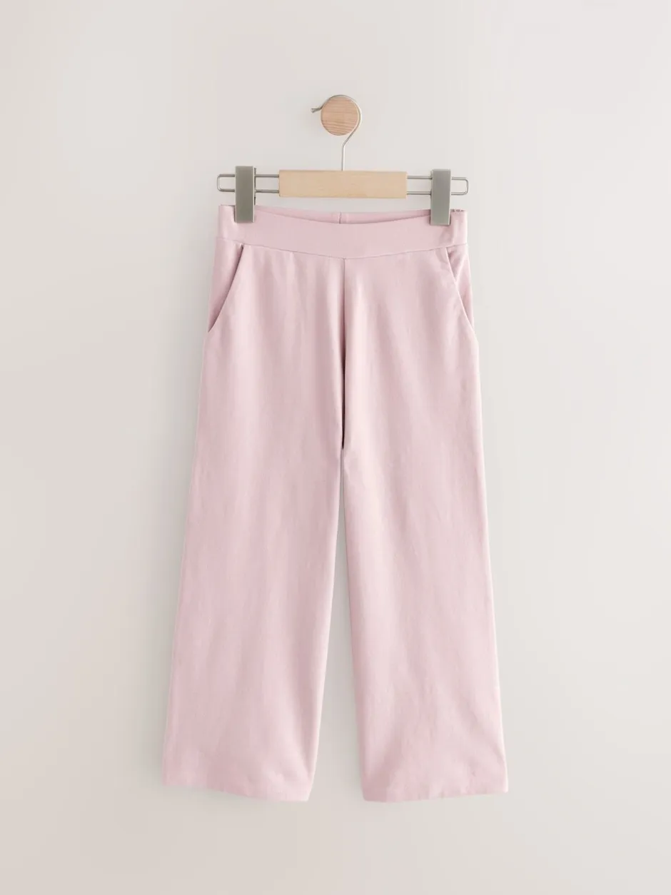 Broeken En Leggings|Next - Jersey broek met wijde pijpen (3-16 jr) Roze