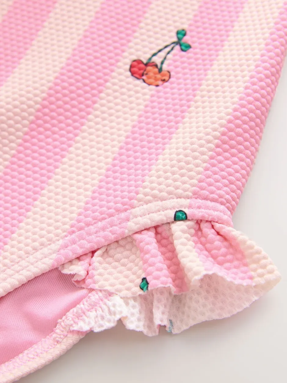 Badkleding|Badkleding|Next - Badpak met ruches op de pijpen (3mnd -7jr) Roze met streep- en kersenprint