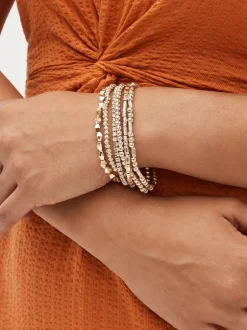 Sieraden|Next - Set van glinsterende rekbare armbanden Rozegouden tinten