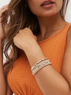 Sieraden|Next - Set van glinsterende rekbare armbanden Rozegouden tinten