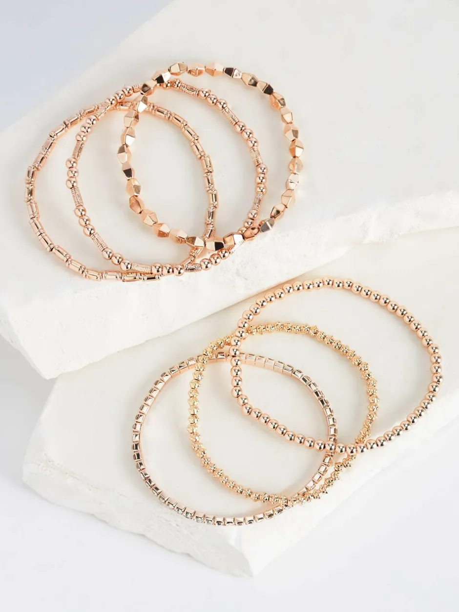 Sieraden|Next - Set van glinsterende rekbare armbanden Rozegouden tinten