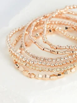 Sieraden|Next - Set van glinsterende rekbare armbanden Rozegouden tinten