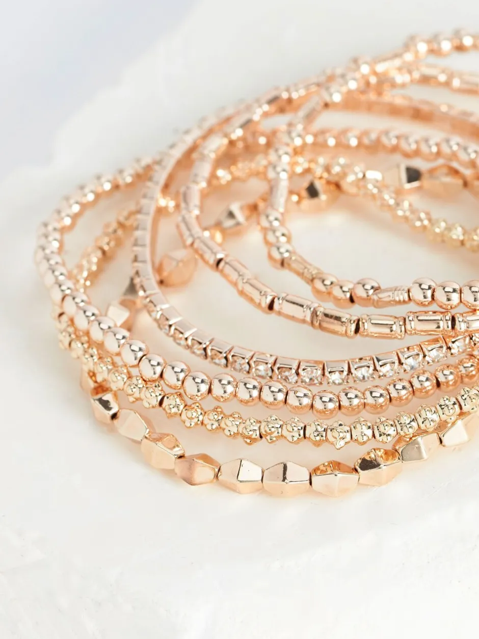 Sieraden|Next - Set van glinsterende rekbare armbanden Rozegouden tinten