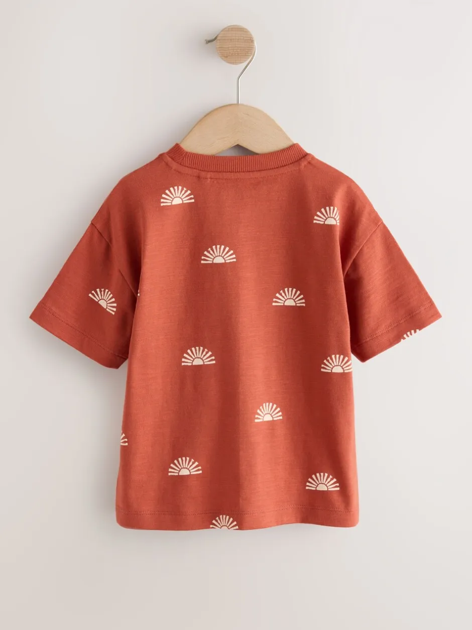 T-Shirts|Tops*Next - Short Sleeve All-Over Print T-Shirt (3 Month-7 Years) (3mths-7yrs) Rust Red Sun