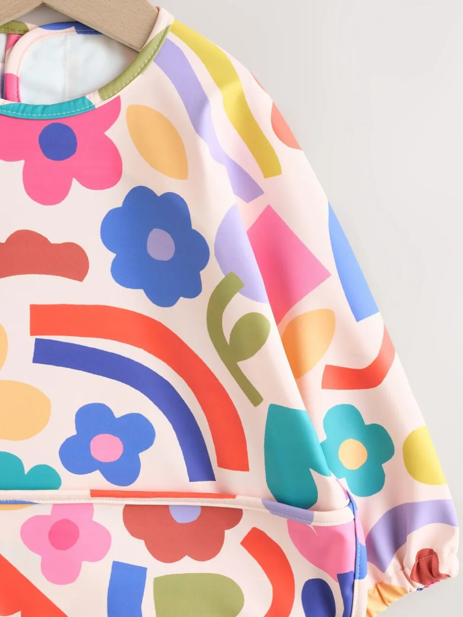 Slabbetjes|Next Stampy Bloemenprint - Slabbetje met mouwen voor spenen en voeden