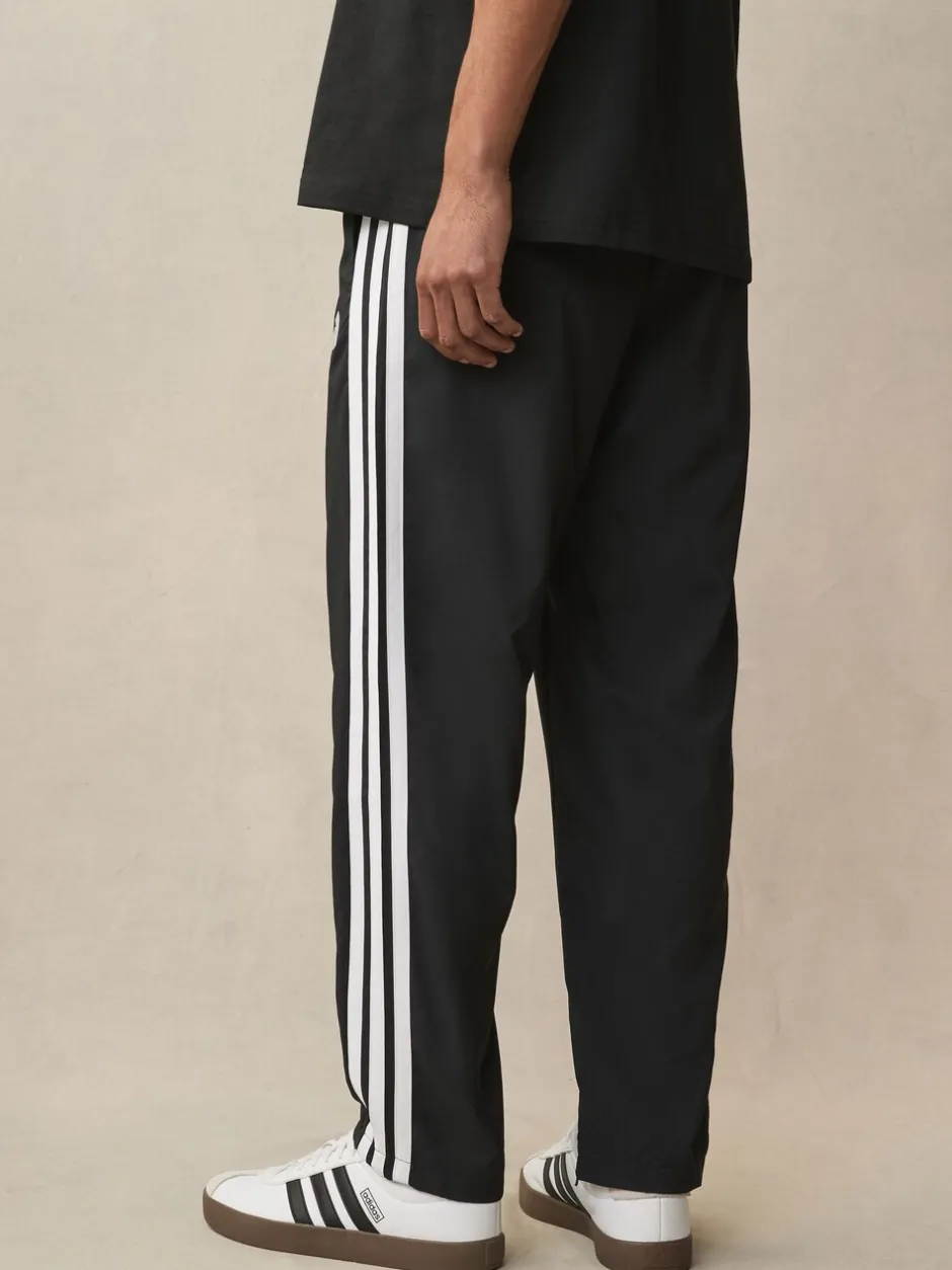 Sportkleding|Joggingbroeken*adidas - Essentials 3-Strepen Stanford joggingbroek met open zoom Zwart