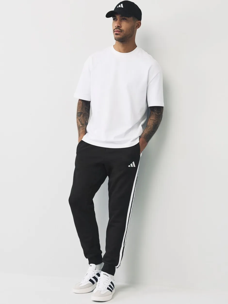 Joggingbroeken*adidas - Essentials fleece joggingbroek met 3 strepen Zwart