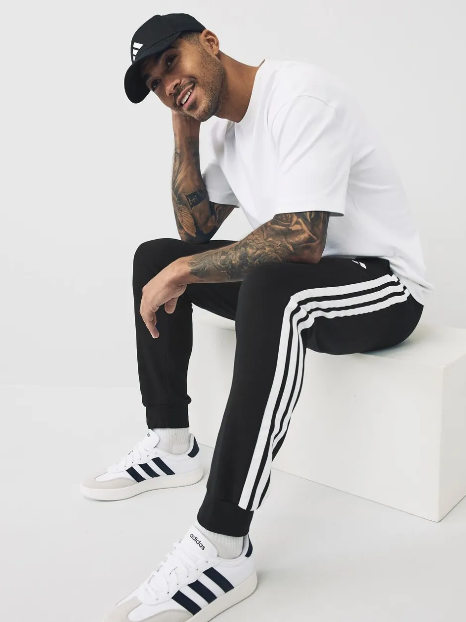 Joggingbroeken*adidas - Essentials fleece joggingbroek met 3 strepen Zwart