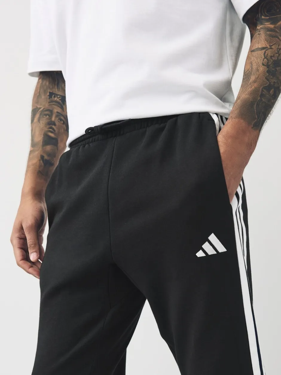 Joggingbroeken*adidas - Essentials fleece joggingbroek met 3 strepen Zwart