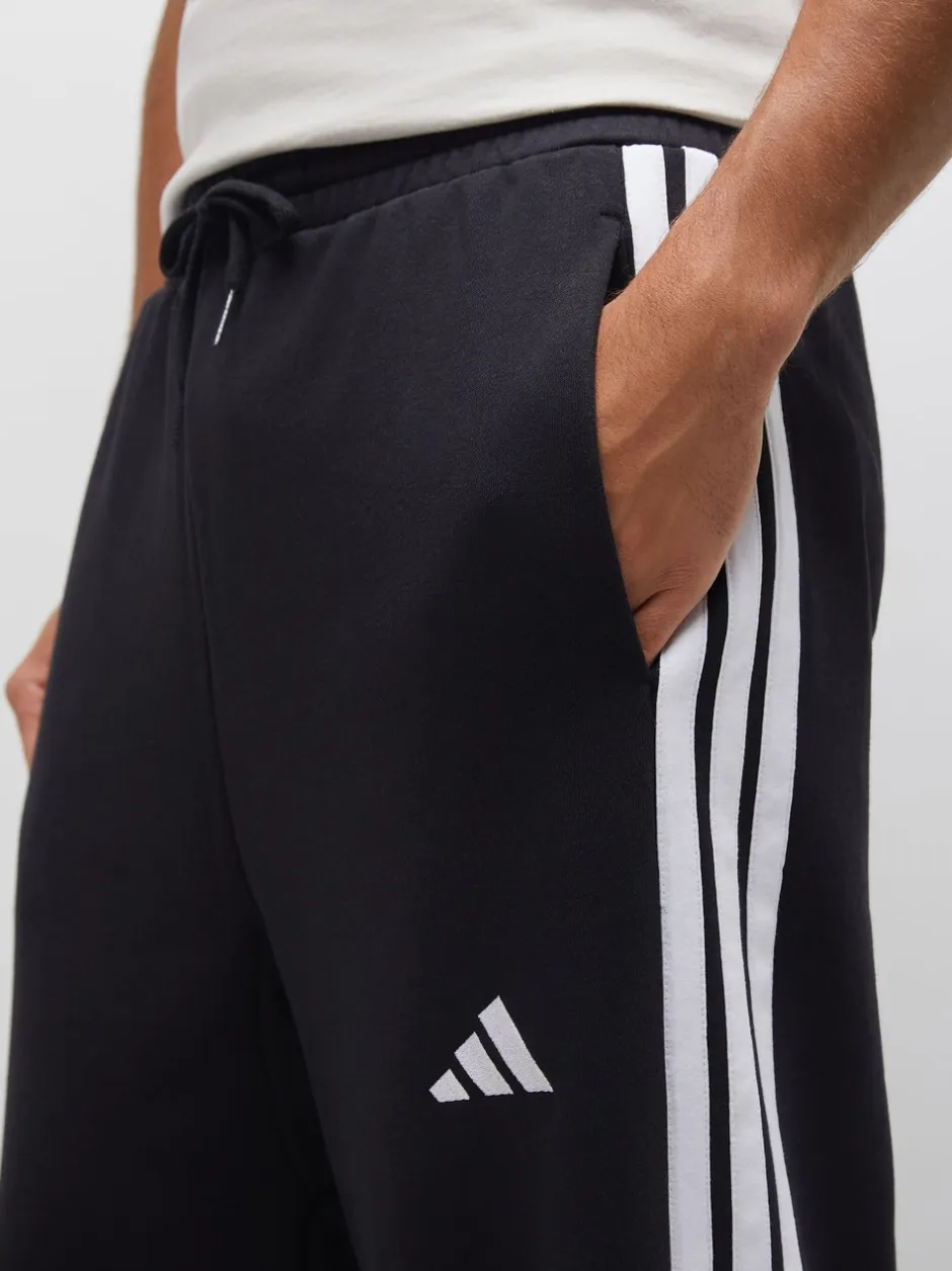 Joggingbroeken|adidas - Essentials Three Stripes Fleece Wide Leg Trousers Zwart