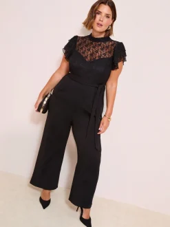 Jumpsuits En Playsuits|Friends Like These Zwart - jumpsuit van kant en scubamix met ruches aan de mouwen