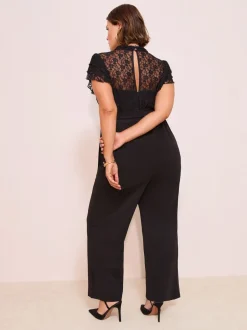 Jumpsuits En Playsuits|Friends Like These Zwart - jumpsuit van kant en scubamix met ruches aan de mouwen