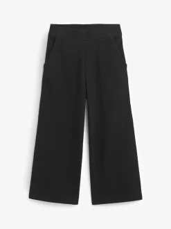 Schoolkleding|Broeken En Leggings|Next - Jersey broek met wijde pijpen (3-16 jr) Zwart