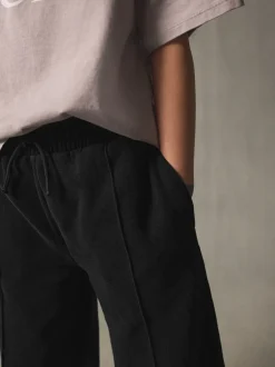 Broeken En Leggings*Next - Joggingbroek met wijde pijpen (3-16jr) Zwart