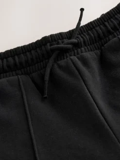 Broeken En Leggings*Next - Joggingbroek met wijde pijpen (3-16jr) Zwart