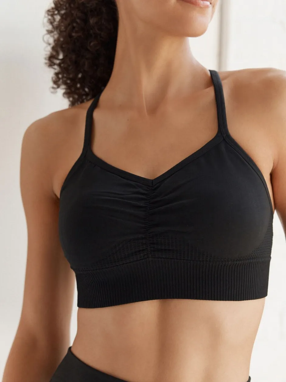 Beha's|Sportkleding|Next - Naadloze sportbeha met bandjes Zwart