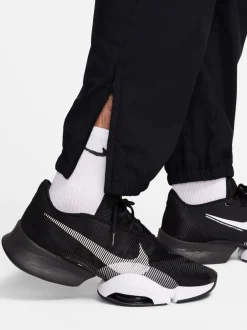 Joggingbroeken*Nike Zwart - Dri-FIT Form trainingsbroek met taps toelopende pijpen