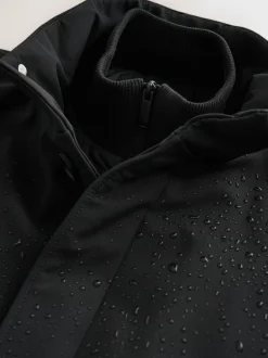 Jassen En Jacks*Next - Normale Pasvorm - Drytech waterdichte gewatteerde jas met opstaande kraag Zwart